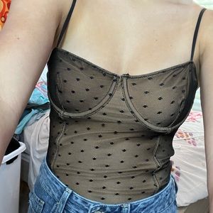 nude and black body suit